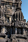 Prambanan - Candi Lara Jonggrang, miniature shrines surmounted by small fluted stupa with panels with musicians and dancers decorating the top of the balustrade 